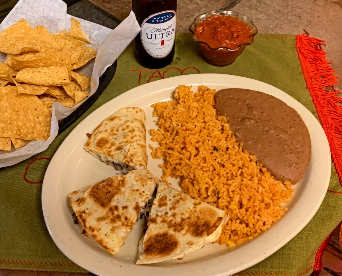 Quesadilla wedges served with Mexican rice and refried beans